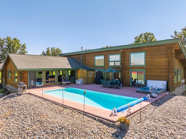 view of swimming pool with area for grilling and a patio area