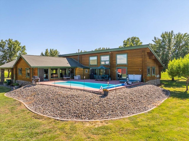 view of swimming pool with a lawn and a patio