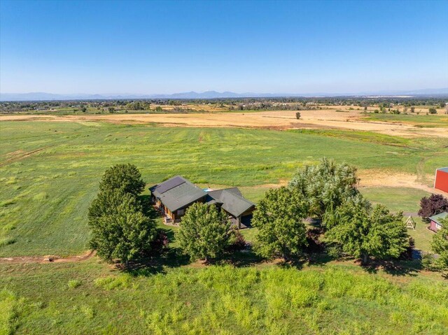 birds eye view of property with a rural view