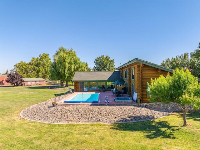 view of pool with a patio and a yard