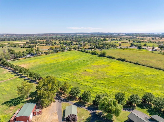 birds eye view of property with a rural view