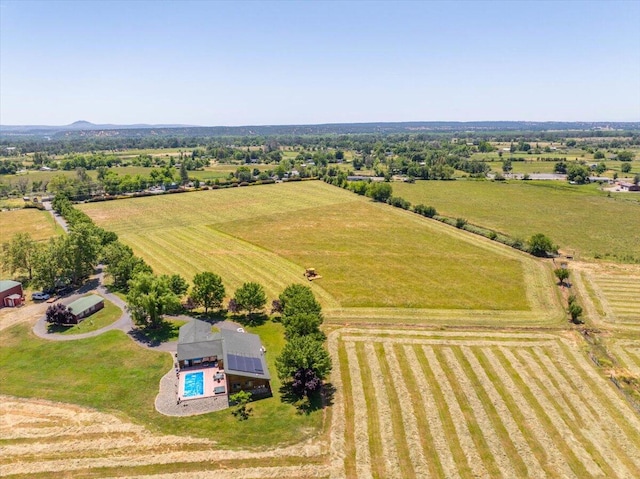 birds eye view of property with a rural view