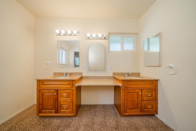 bathroom with vanity and plenty of natural light