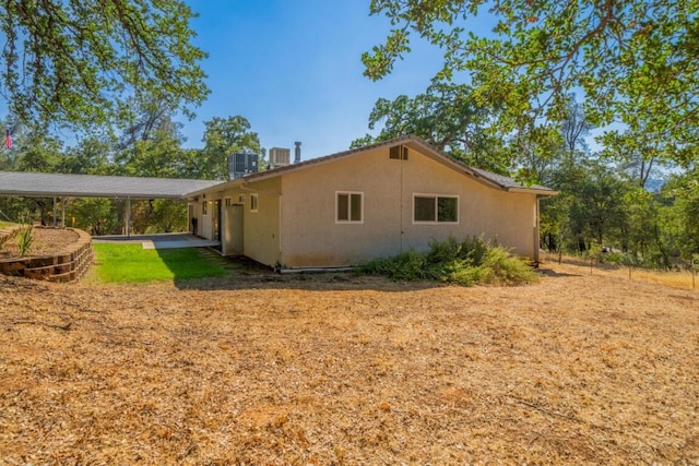 view of property exterior featuring central AC