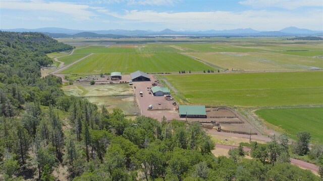 drone / aerial view featuring a rural view and a mountain view