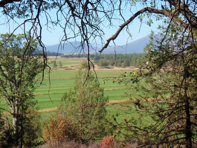 exterior space with a rural view and a mountain view