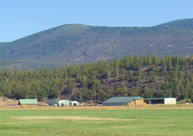 view of mountain feature with a rural view