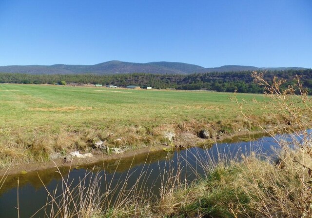 mountain view with a water view