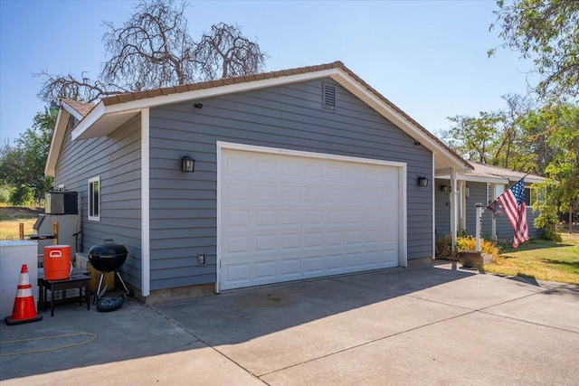 garage featuring wooden walls