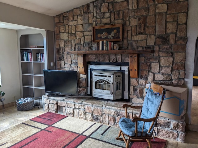 tiled living room with a wood stove