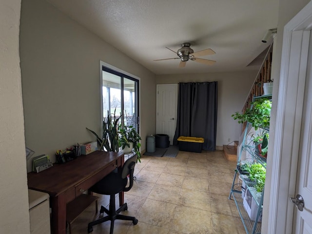 office area featuring a textured ceiling and ceiling fan