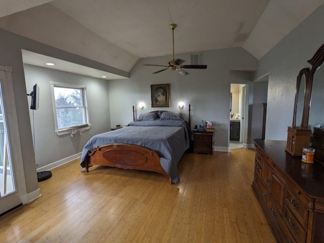 bedroom featuring connected bathroom, ceiling fan, vaulted ceiling, and light hardwood / wood-style flooring