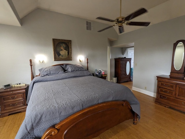 bedroom featuring ceiling fan, light hardwood / wood-style flooring, and vaulted ceiling