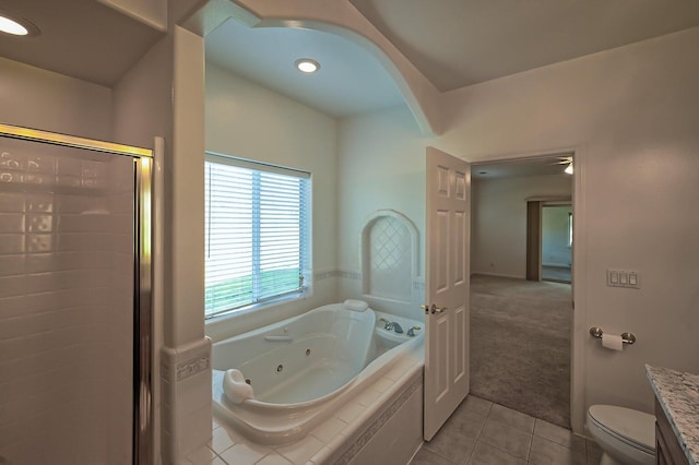 full bathroom with tile patterned floors, toilet, vanity, and shower with separate bathtub