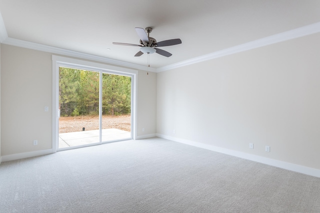 unfurnished room with crown molding, carpet floors, and ceiling fan