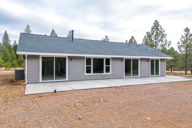 back of house with a patio and central air condition unit