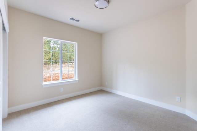 unfurnished room with carpet flooring