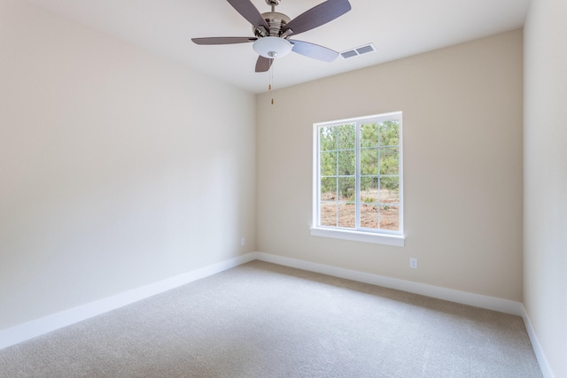 carpeted empty room with ceiling fan