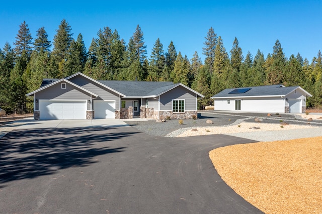 ranch-style home featuring a garage