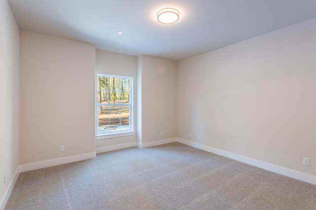 unfurnished room featuring carpet