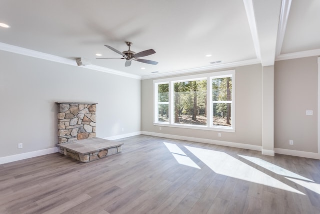 unfurnished living room featuring light hardwood / wood-style flooring, crown molding, and ceiling fan