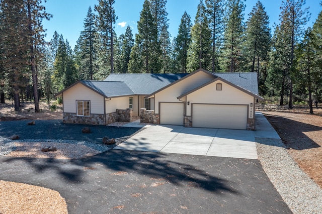 ranch-style house featuring a garage