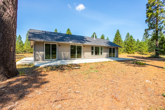 back of property with a patio area