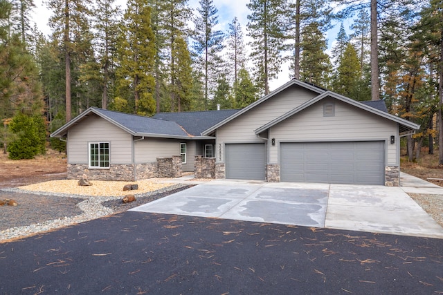 ranch-style house featuring a garage