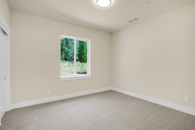 unfurnished room featuring carpet floors