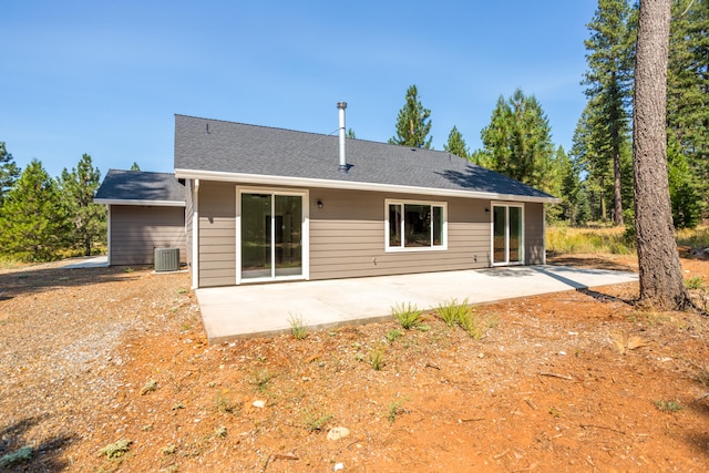 back of house with a patio and central AC unit