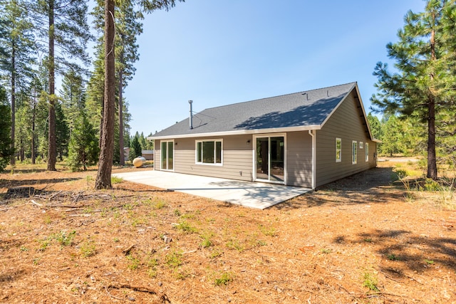 rear view of property featuring a patio area