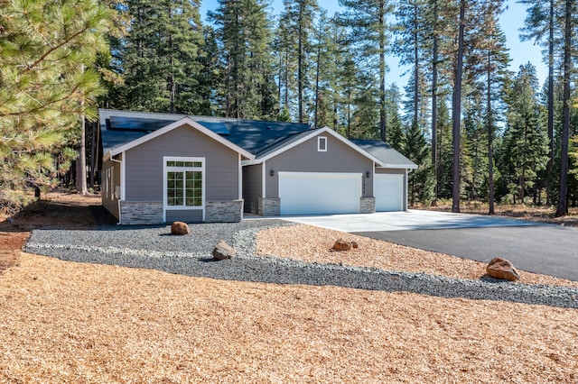 ranch-style home featuring a garage