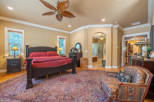 bedroom with hardwood / wood-style flooring, ornamental molding, multiple windows, and ceiling fan