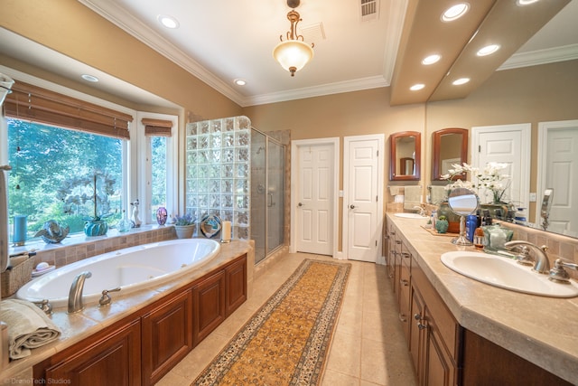 bathroom featuring plus walk in shower, crown molding, dual vanity, and tile patterned floors