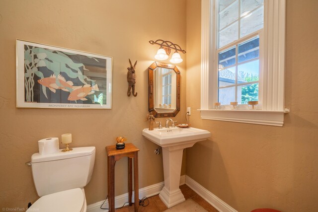 bathroom with tile patterned flooring and toilet