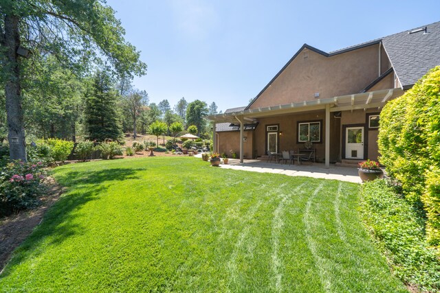 view of yard with a pergola and a patio