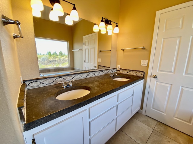 full bath featuring tile patterned flooring, double vanity, and a sink