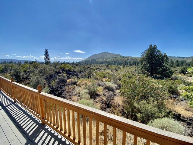 property view of mountains featuring a forest view