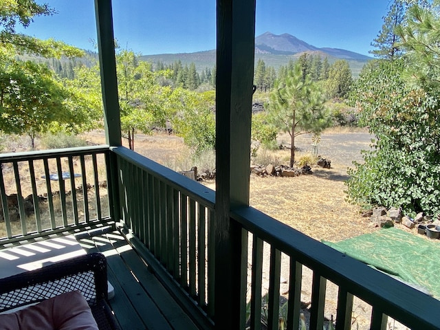 wooden terrace featuring a mountain view