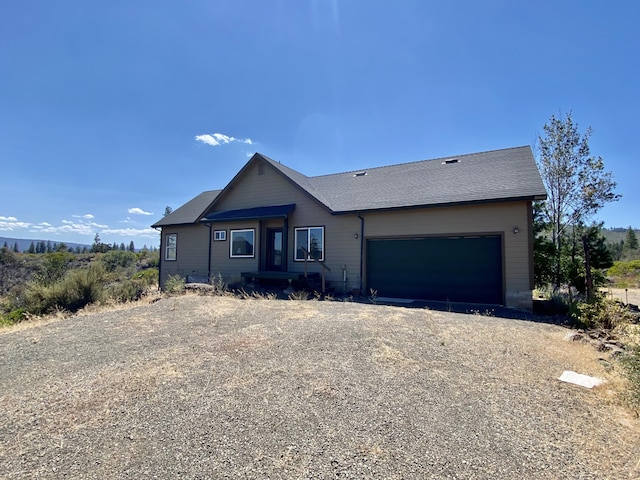 view of front of property featuring a garage and driveway