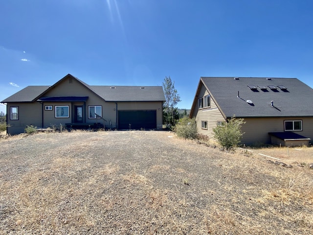 view of front of property with driveway and an attached garage