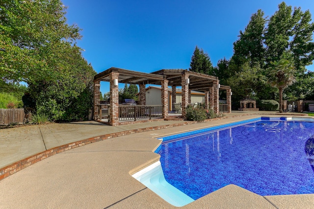 view of swimming pool with a pergola and a patio