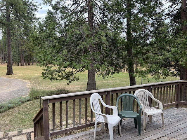 deck featuring a lawn