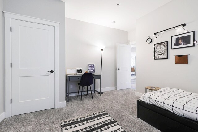 bedroom featuring light colored carpet