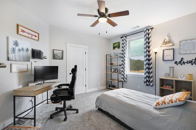 carpeted bedroom with ceiling fan