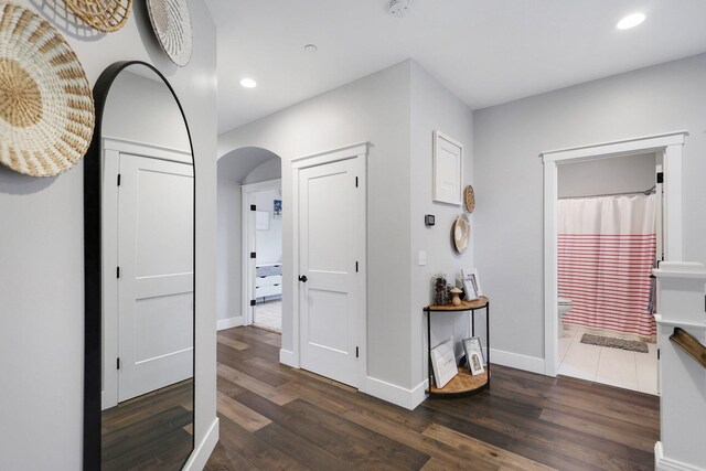 corridor featuring dark wood-type flooring