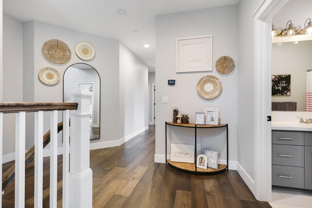 corridor featuring dark hardwood / wood-style flooring