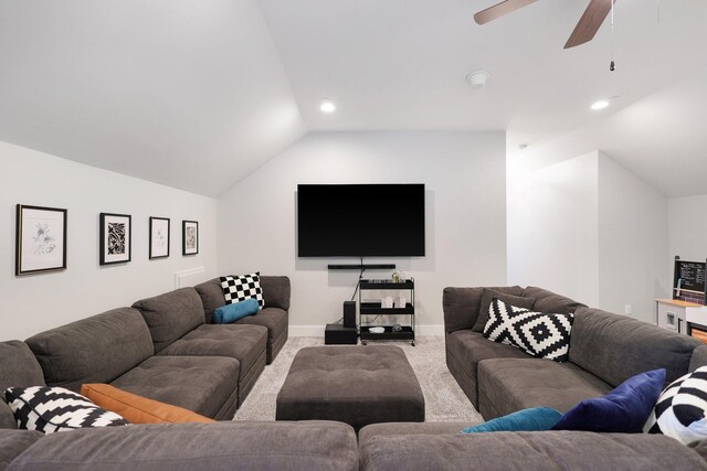 living room featuring ceiling fan, light carpet, and lofted ceiling