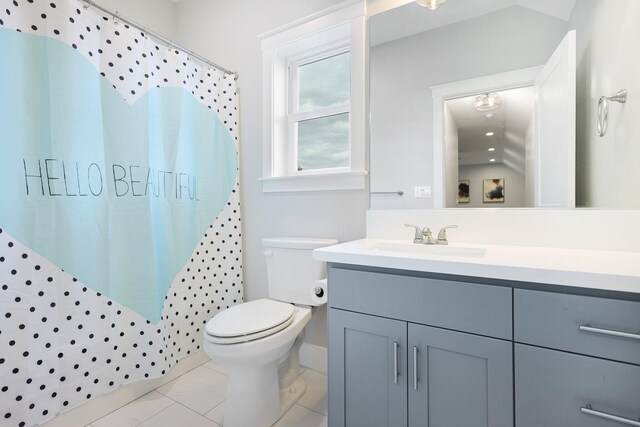 bathroom featuring tile patterned floors, toilet, vanity, and a shower with curtain