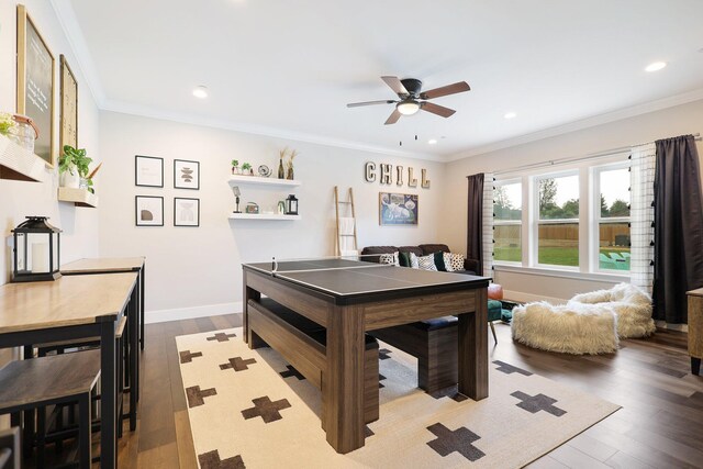 game room with ceiling fan, ornamental molding, and wood-type flooring